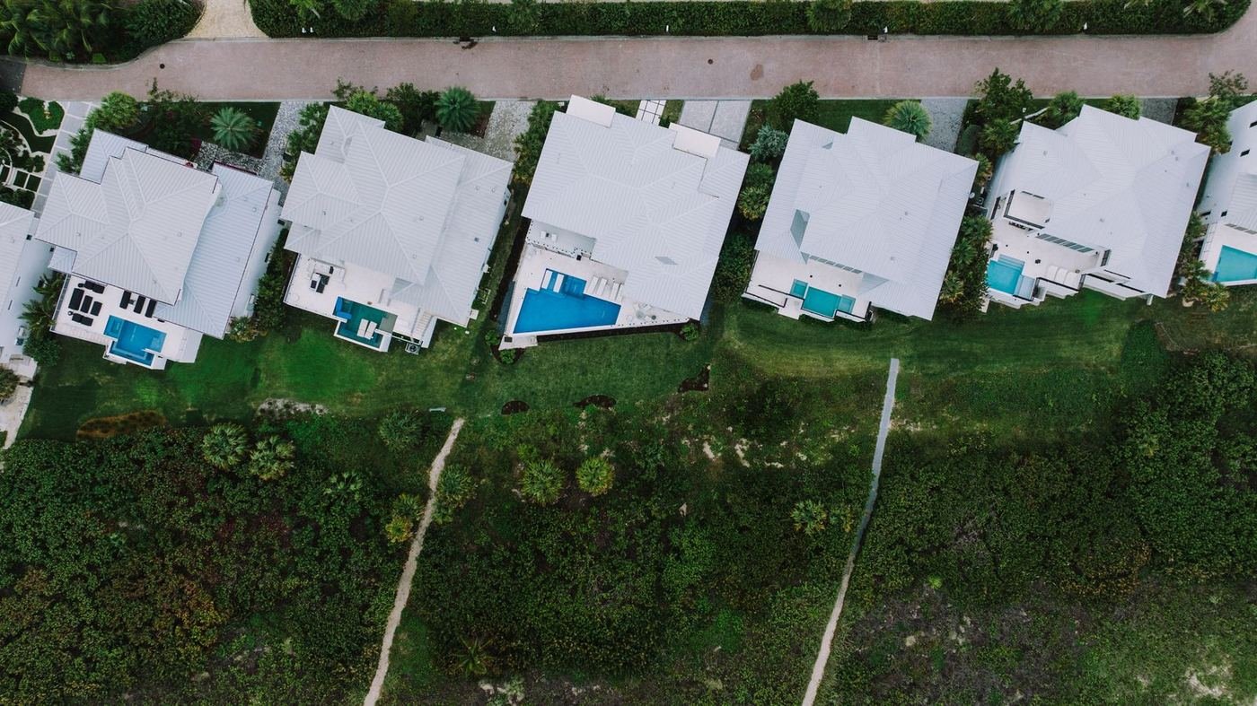Aerial view of Florida pool homes in a gated community (illustrative photo)