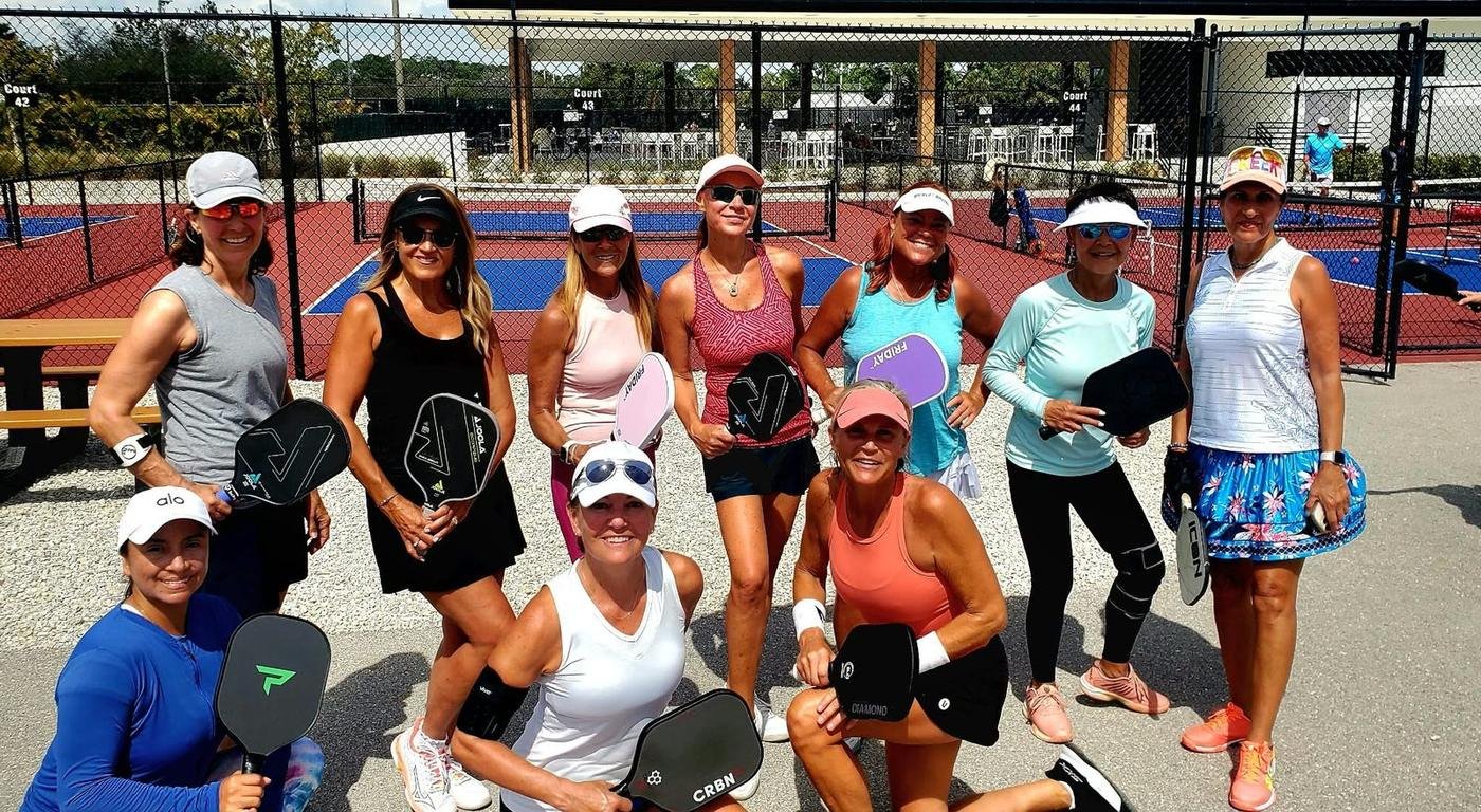 Jill Jacobs with pickleball friends beside the courts in Naples