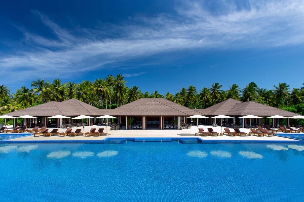 Resort-style community pool with palm trees in Southwest Florida (illustrative photo)
